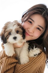 Pretty young women super models of Japanese ethnicity holding Lhasa Apso puppy with expressive expression, no crop head. photo on white isolated background 