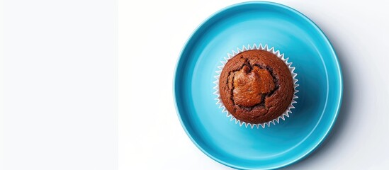 Aufkleber - organic homemade vanilla chocolate butter cup cake muffin bread is on the blue plate and isolated on white background (clipping path included). with copy space image. Place for adding text or design