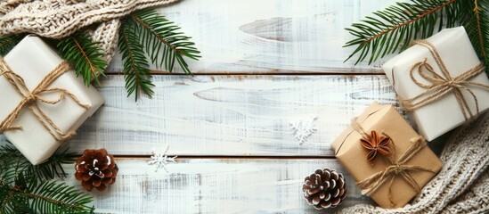 Poster - Christmas composition. Christmas gifts, fir tree branches, knitted blanket on white wooden background. Flat lay, top view, copy space. Copy space image. Place for adding text or design