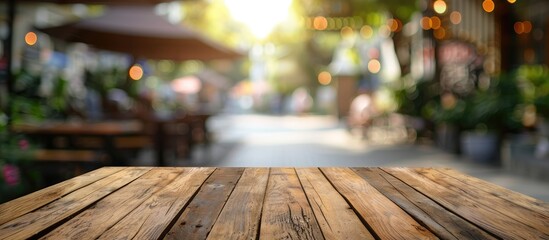 Aufkleber - Selected focus empty brown wooden table and Coffee shop or restuarant blur background with bokeh image. for your photomontage or product display. with copy space image