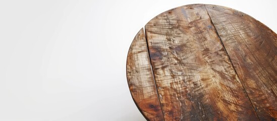 Wall Mural - Round wooden table with four feet in white background. with copy space image. Place for adding text or design