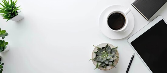 Poster - Modern workplace with tablet, books, houseplant and coffee cup on white table. Copy space for your text and product display .