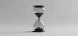 © patcharida - An hourglass sitting alone on a plain background