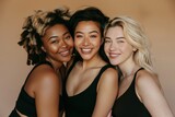 Three Multi Ethnic Group of Womans with diffrent types of skin and age groups together and looking on camera. Diverse ethnicity women - Caucasian, African and Asian posing and smiling.