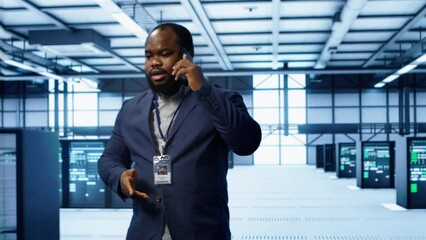 Poster - it technician talking on phone in data center, coordinating server maintenance and troubleshooting t