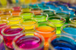 © alexandr - Rows of glass jars filled with colorful liquids creating a rainbow effect