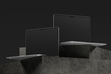 Two Laptops Resting on a Gray Stone Platform