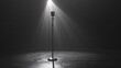 © HM Design - A microphone under a dramatic spotlight, ready for a powerful performance.