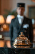 © Fabio - Hotel Concierge: bell on the reception front desk with waiter