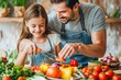 © Straxer - Happy father and daughter preparing vegetables to make a plate of food looking knowingly cooking at home