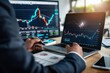 © Surachetsh - Stock management session features a laptop monitoring stock market graph analysis and algorithmic trading direction.