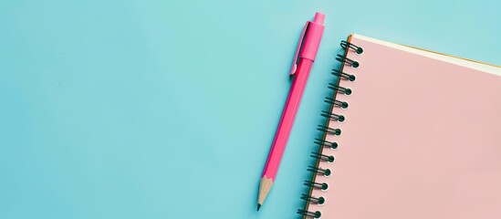 Poster - Back to school, education concept - pink eco friendly pen and pencil and spiral blank notebook on blue background for the start of the school year or the start of the school semester