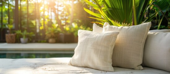 Wall Mural - Comfortable pillow on sofa decoration outdoor patio with tropical and nature view. Copy space image. Place for adding text and design