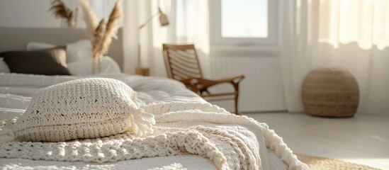 Poster - A knitted cushion cover in a modern bedroom in morning sunlight. Copy space image. Place for adding text and design