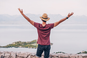 Wall Mural - A young hiker enjoying the freedom of nature near Lake Skadar, Montenegro.