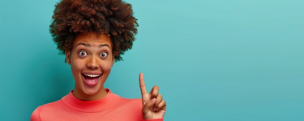 Wall Mural - A woman with a pink shirt and green earrings is making a peace sign with her hands. She has a surprised look on her face. Free copy space for text.