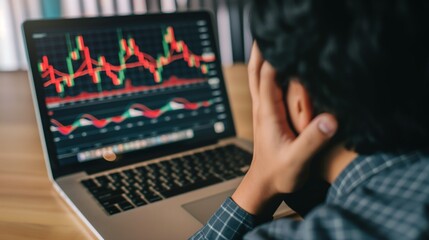 Wall Mural - Stress Business man look at to the laptop show financial market chart graphic going down. Stock market concept