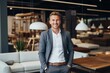 © Vorda Berge - Smiling portrait of a young male sales person in furniture store