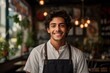© Vorda Berge - Smiling portrait of a young waiter in the restaurant