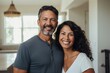 © CojanAI - Portrait of a smiling middle aged Hispanic couple in new home
