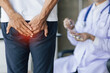 © Wasan - Man having butt pain and hemorrhoids.