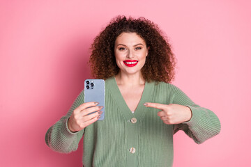 Wall Mural - Photo of adorable lovely nice woman wear stylish khaki clothes buy phone isolated on pink color background