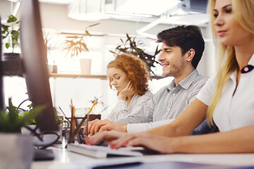 Aufkleber - Dynamic Office with Modern Equipment and Focused Workers: Modern office setting filled with diligent professionals working at sleek desks, enhancing productivity and innovation