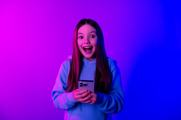 Sticker - Photo of excited pretty little lady dressed hoodie chatting instagram twitter telegram facebook isolated neon purple color background