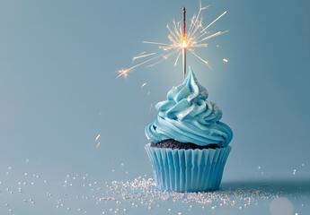 blue cupcake with sparkler on blue background