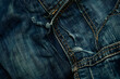 © Saran - Detailed Close-up of Denim Jeans Texture Showcasing Intricate Weave and Authentic Wear Patterns