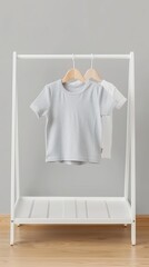 Wall Mural - A close-up image of five neutral-colored clothing items hanging on a white garment rack