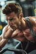 © Jorge Ferreiro - Determined male working out in gym