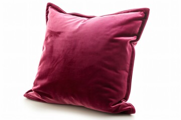 Luxurious pink velvet cushion displayed isolated against a white background, highlighting its plush texture and rich color