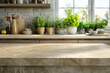 © Balica - Marble beige countertop, empty table near the window and plants in kitchen, blurred background, mock up for display of product or montage.
