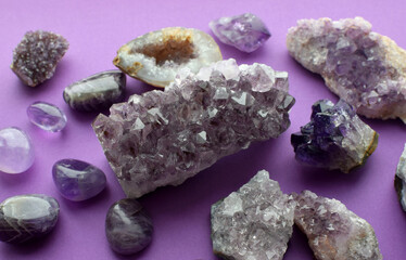 Wall Mural - Beautiful purple drusy crystals and amethyst geodes close up. Healing crystals.