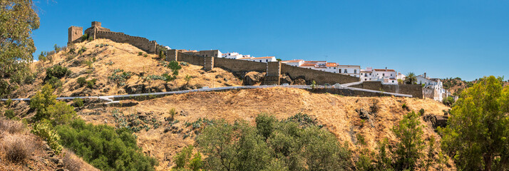 Wall Mural - Panoramic view of Mértola castle in Portugal on a sunny day in summer.