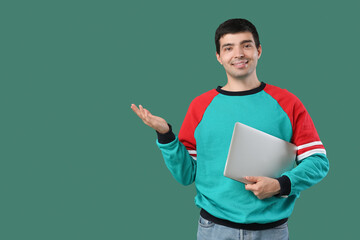 Sticker - Male programmer with laptop showing something on green background