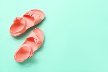 Canvas Print - Pair of stylish child's sandals on color background