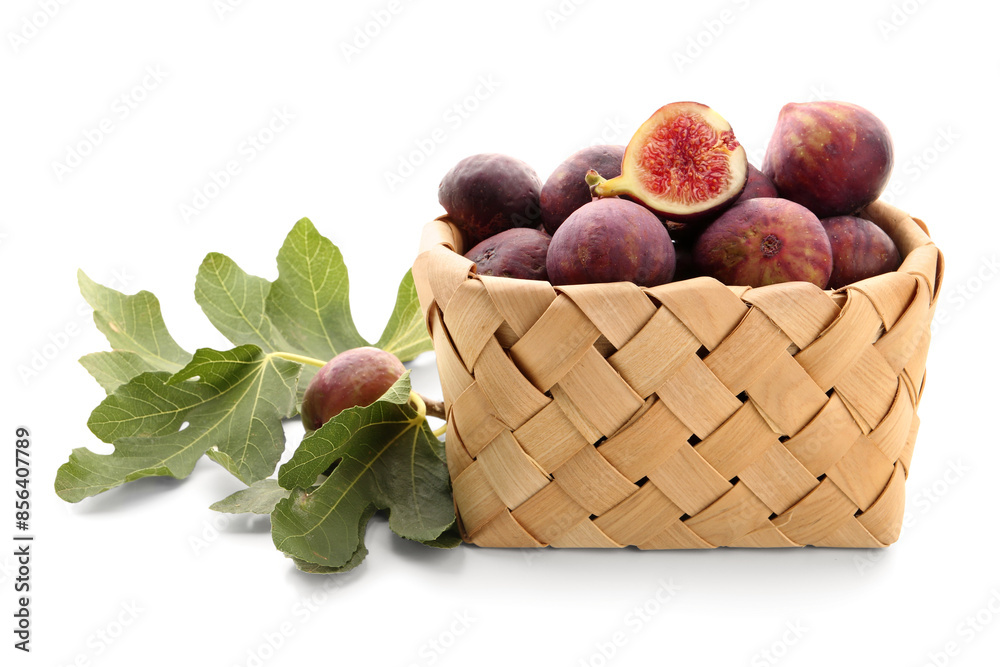 Wicker bowl with fresh ripe figs on white background