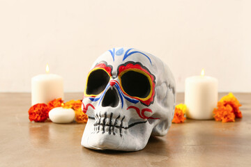 Sticker - Painted skull with marigold flowers and candles on color background. Celebration of Mexico's Day of the Dead (El Dia de Muertos)