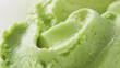 © Ice Cream Paradise - Velvety pistachio sorbet, a closeup image of velvety pistachio sorbet, its rich green color and smooth texture highlighted against a pure white background