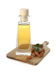 Wall Mural - Bottle of almond oil and fresh nuts isolated on white