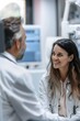 © CYBERUSS - Doctor Consulting with Patient in Bright Modern Clinic with Medical Equipment
