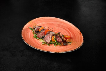 Canvas Print - Delicious Beef Roast with Tomatoes and Arugula on Decorative Plate - High-Quality Food Photography