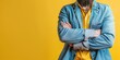 © xartproduction - A man in a blue jacket and yellow shirt is standing with his arms crossed