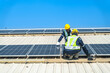© ultramansk - Worker Technicians are working to construct solar panels system on roof with sky and clound on background. Installing solar photovoltaic panel system. Renewable clean energy technology concept.