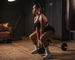 © Михаил Решетников - Caucasian woman doing squats with kettlebell in retro gym.