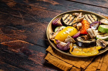 Wall Mural - Various grilled Vegetables, bell pepper, zucchini, eggplant, onion and tomato. Wooden background. Top view. Copy space