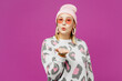 © ViDi Studio - Young trendy happy lesbian woman wearing pink animal clothes hat sunglasses looking camera blow send kiss isolated on plain purple background studio portrait. Pride day June month love LGBTQ concept.