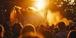 © inspiretta - crowd of people watching a band perform on stage at a concert or festival at sunset or sunrise time